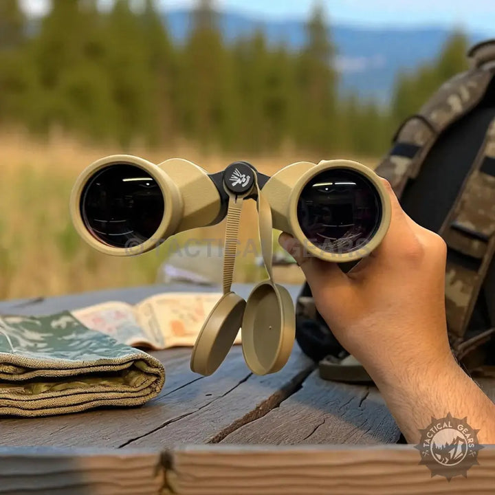 Tan binoculars with attached lens caps featuring 12X50 FMC Coated Green Lens for clear viewing