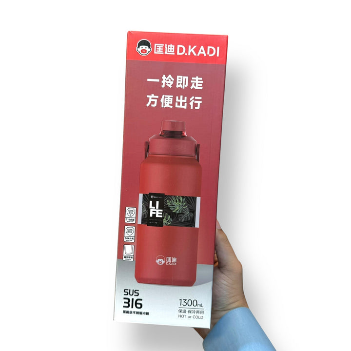 Red insulated 1300ml thermal hot vacuum bottle in retail packaging with handle