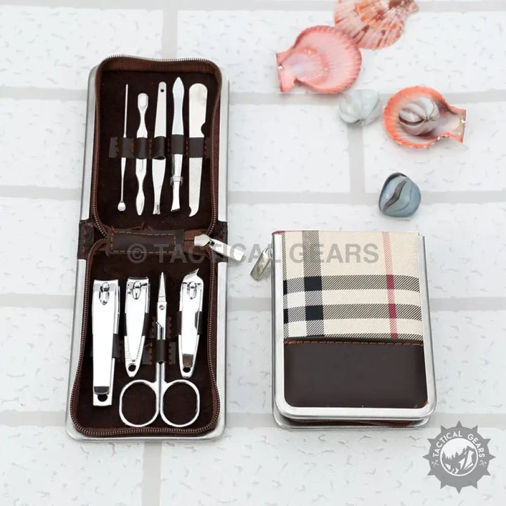 Portable Nailed IT Complete Manicure Kit with steel nail grooming tools in a plaid case