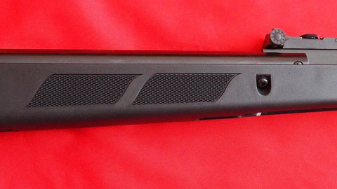 Black air rifle with textured grip panels showcasing safety and high force performance