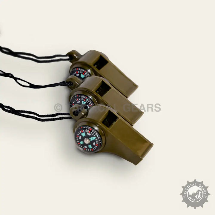 Olive green plastic whistles with embedded compasses and black lanyards for survival