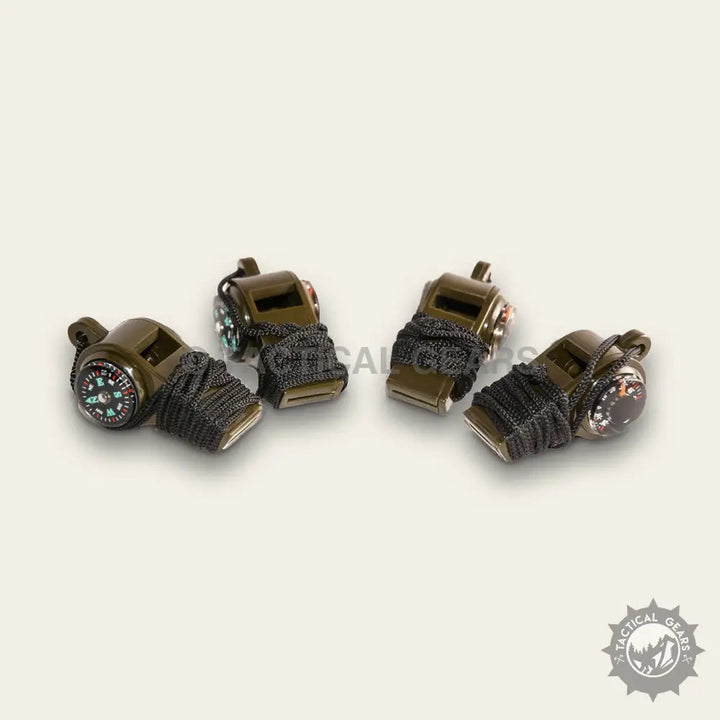 Olive green survival whistles with integrated compasses and black paracord accents