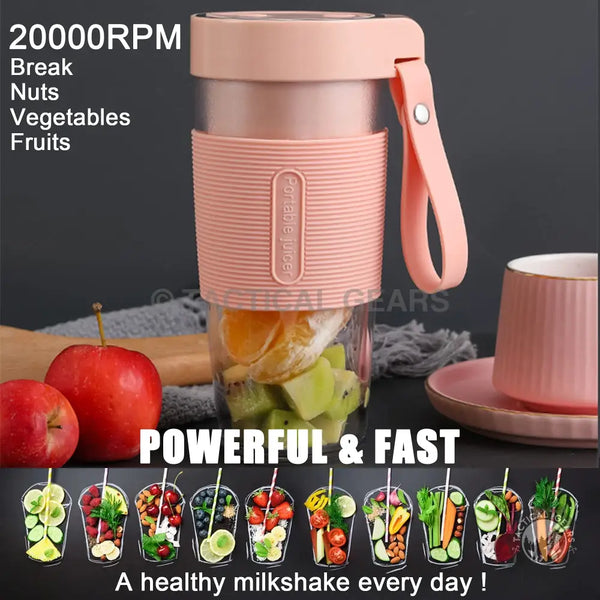 Portable pink blender with hand strap filled with fruit for on-the-go smoothies
