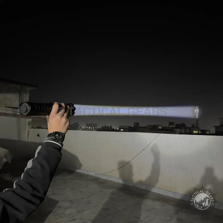Powerful 5000 Lumens White Laser Flashlight illuminating the night sky with long-range light