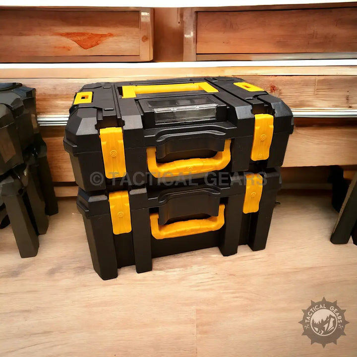 Black and yellow interlocking modular toolboxes on wooden floor with 21v rechargeable tools