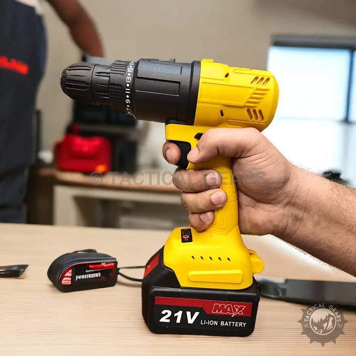 Yellow and black cordless drill with 21V rechargeable Li-ion battery from 7-in-1 21V Tools Set