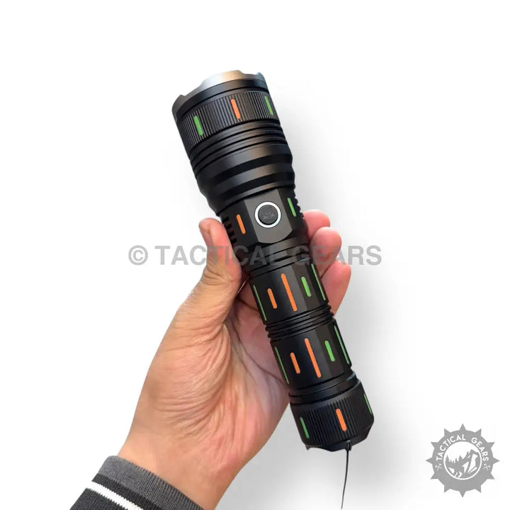 Black tactical flashlight with green and orange accents, part of a powerful flashlights lot