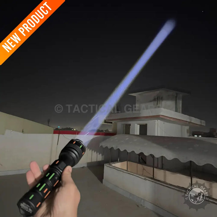 Black flashlight with colorful accents emitting a strong blue beam from 8000mAh rechargeable powerful flashlights lot