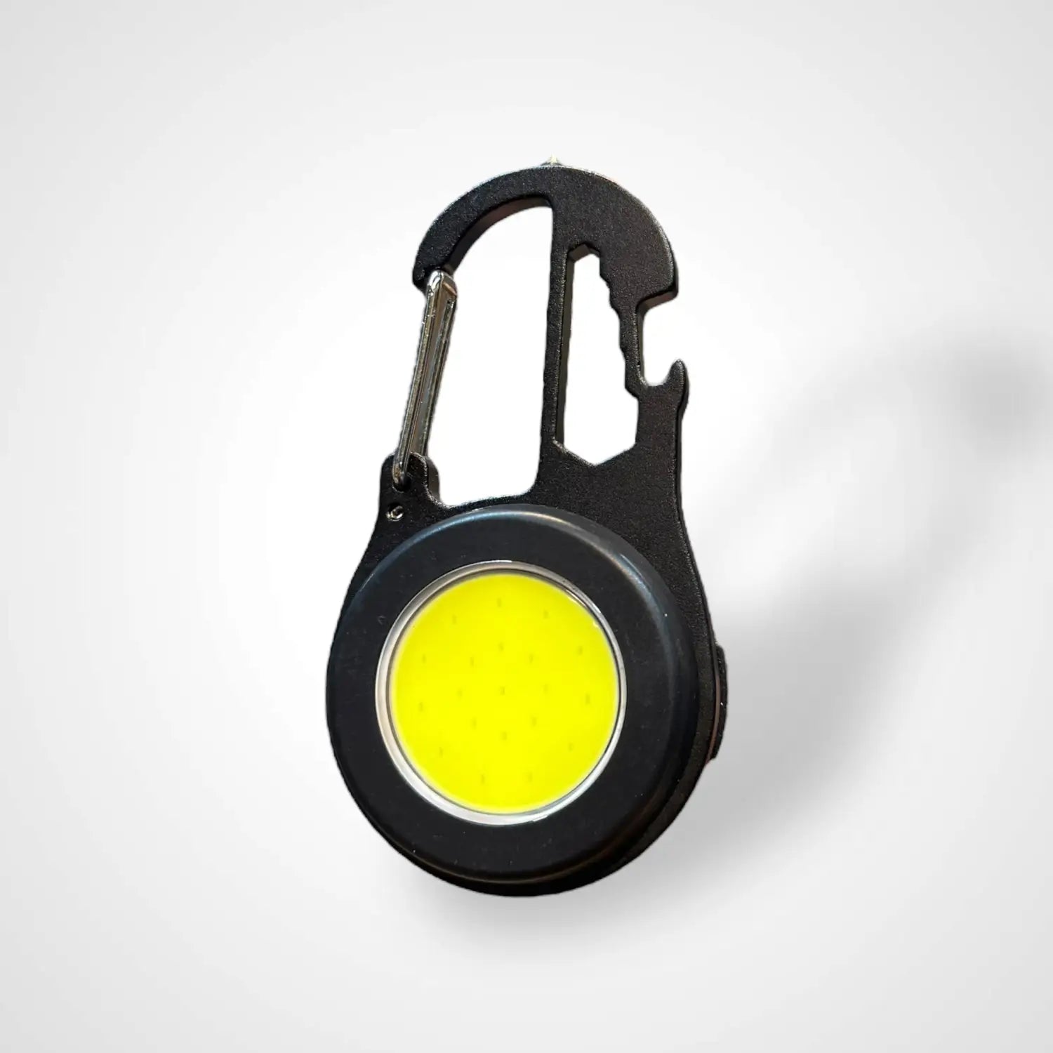 Black multi-tool carabiner with bright yellow COB LED light, ideal tactical keychain flashlight