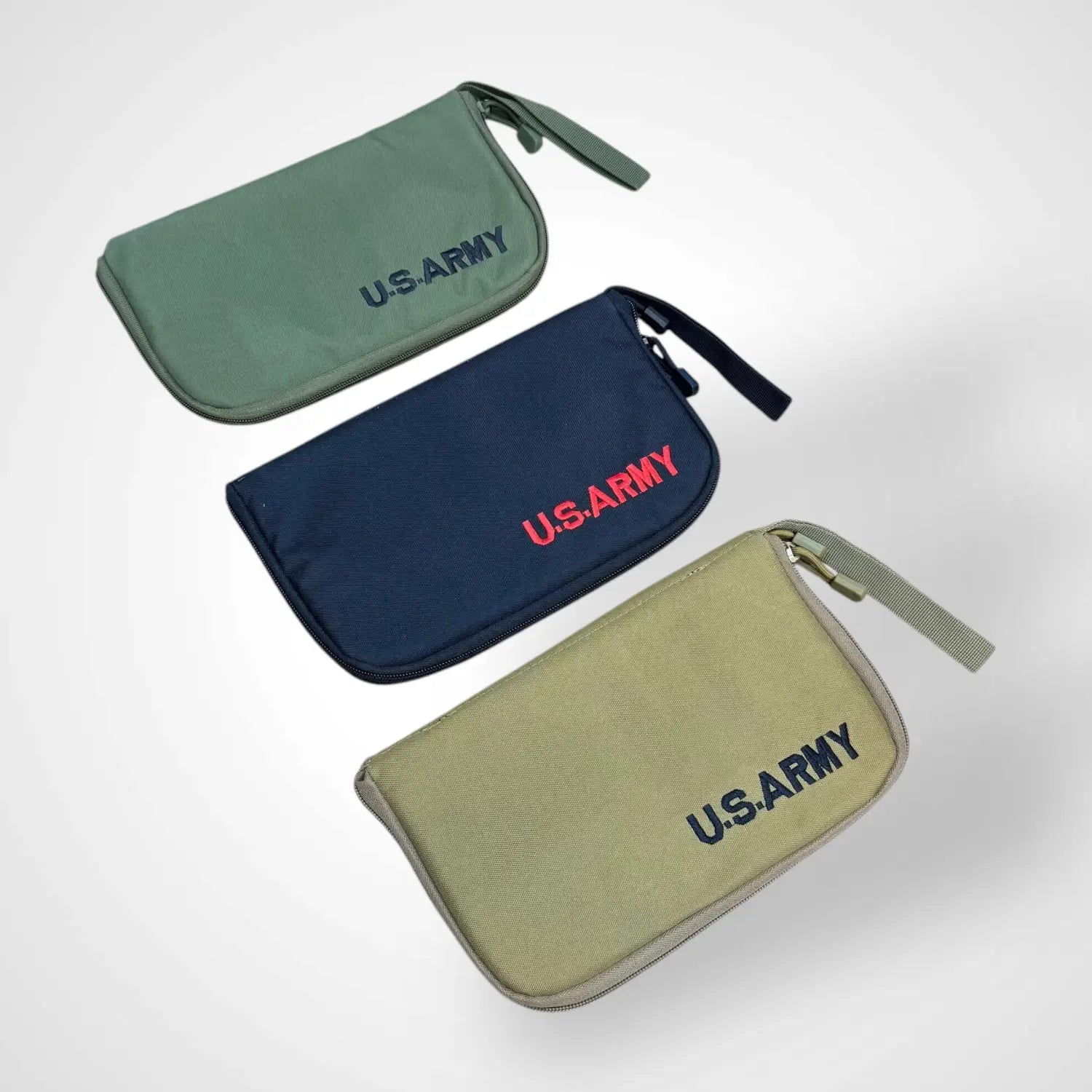 Three zippered tactical pistol carrying pouches in green navy and tan for versatile pistol carrying