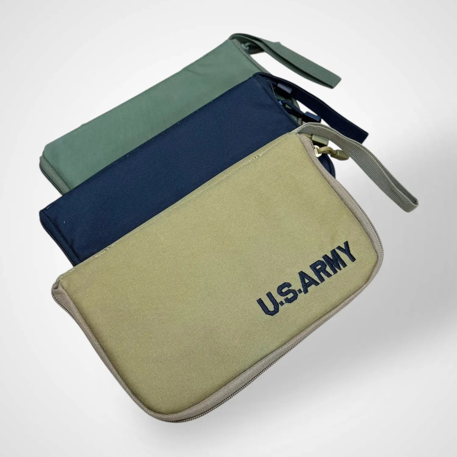 Three tactical pistol carrying pouches in green and blue for versatile pistol carrying