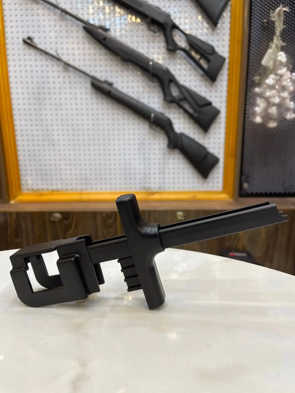 Black plastic rifle speed loader cleaning rod with handle and attachments for universal rifle cleaning