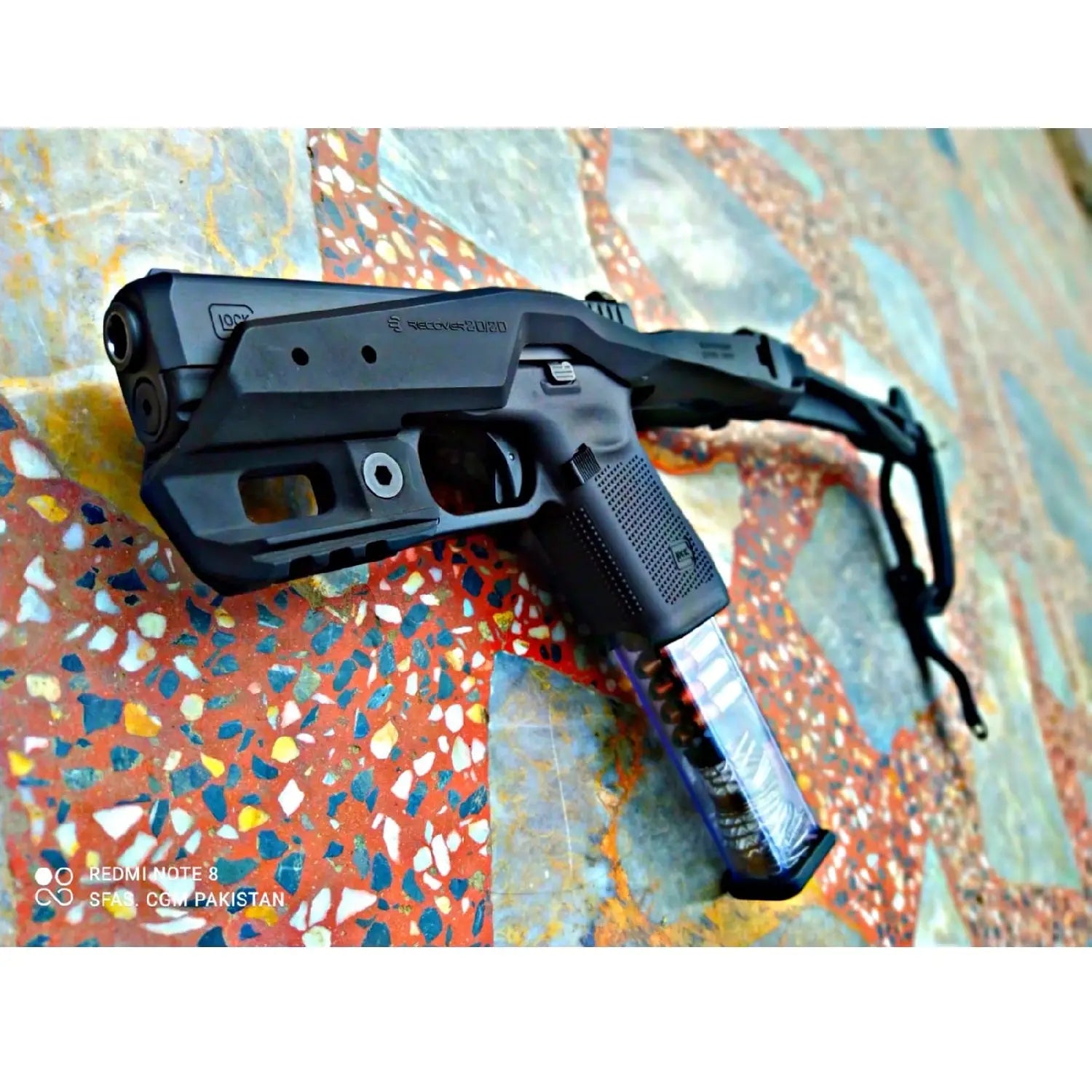 Black Pistol Carbine Stabilizer Kit with Folding Stock featuring a black handgun with extended magazine