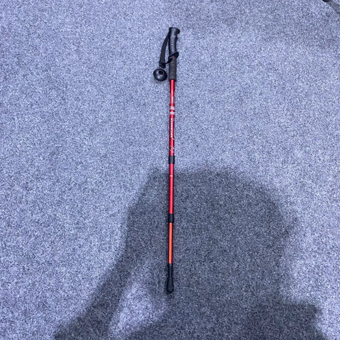 Red and black adjustable antishock hiking stick for outdoor trekking and hiking adventures