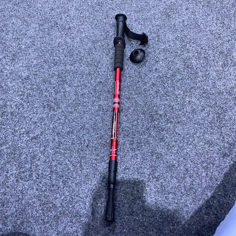 Red and black adjustable antishock hiking stick with rubber foot for trekking and stability