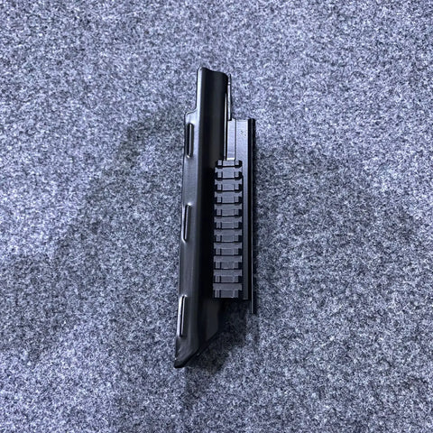 Black metal firearm rail system on Tactical Picatinny Quad Rail Handguard for enhanced customization