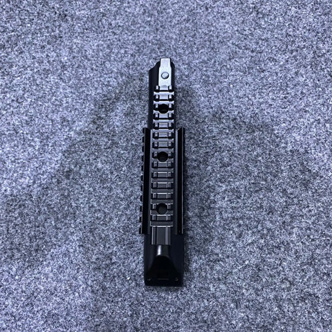 Black metal quad rail handguard with Picatinny sections and front sight post