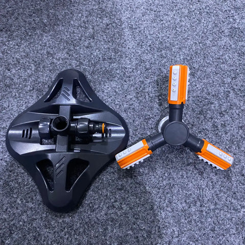 Two-piece black and orange garden sprinkler system for efficient irrigation and optimal spray distance