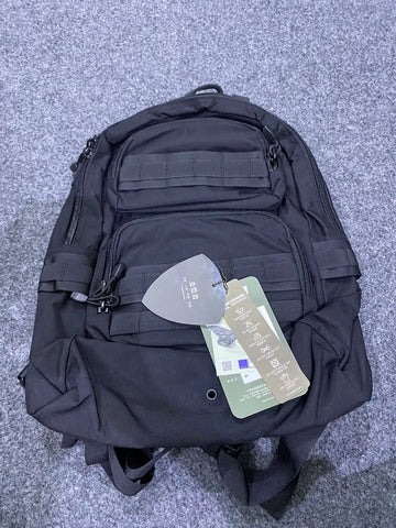 Black Buck Tactical Backpack with multiple compartments and attached tags for versatile storage