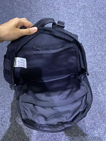 Open black buck bag with multiple mesh and zippered compartments for tactical use