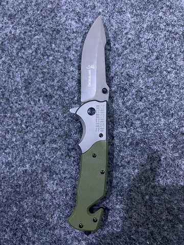 Green and silver Browning DA308 Tactical Knife with serrated blade and bottle opener