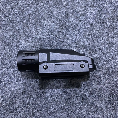 Black tactical flashlight with attachable laser sight and laser sight functionality