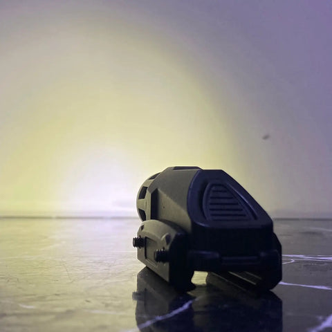 Black tactical flashlight with textured grip and mounting for attachable flashlight on Tactical Scope and Barrel