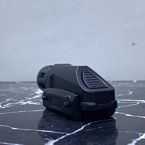 Compact black tactical flashlight attached to Tactical Scope and Barrel for enhanced visibility