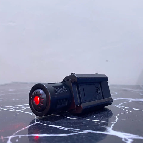 Black attachable laser sight with flashlight and red laser emitter for tactical rifles