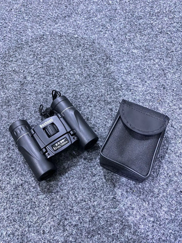 Black compact pocket binoculars with matching case for bird watching and outdoor adventures