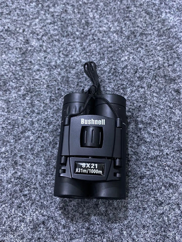 Black Bushnell folding binoculars for compact pocket bird watching adventures