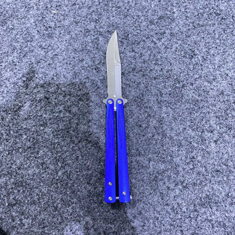 Blue butterfly knife with silver blade, approx 4 inches, shown with black sheath