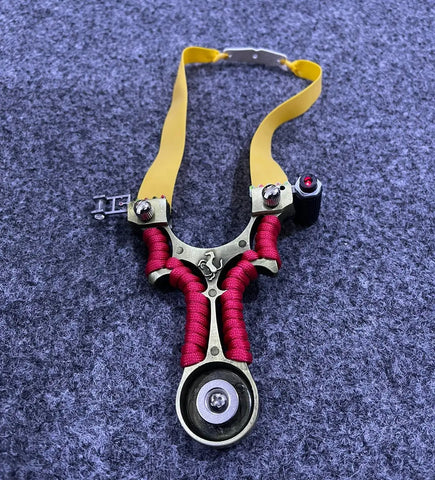 Wide Fork Metal Slingshot with Laser Sight and Level featuring yellow bands and red handle wrap