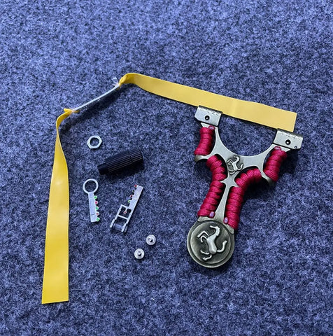 Wide Fork Metal Slingshot with Red Cord and Yellow Rubber Band for Precision Shooting