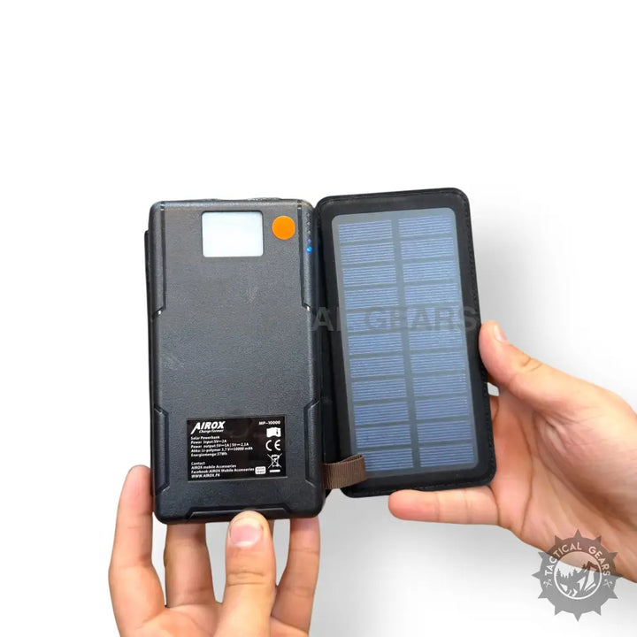 Black foldable Solar Power Bank with digital display and orange button for AIROX MP-10000
