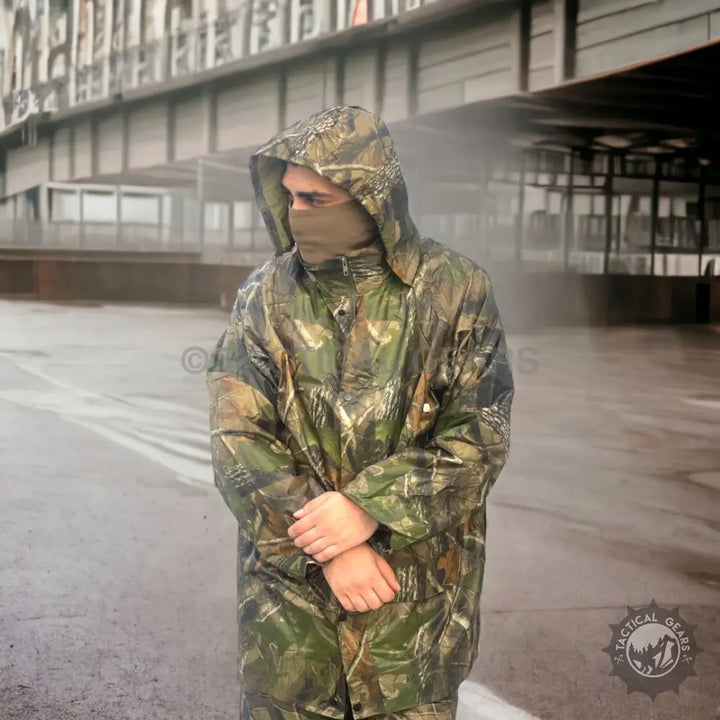 Camouflage waterproof hooded rain suit for men, ideal for outdoor weather protection