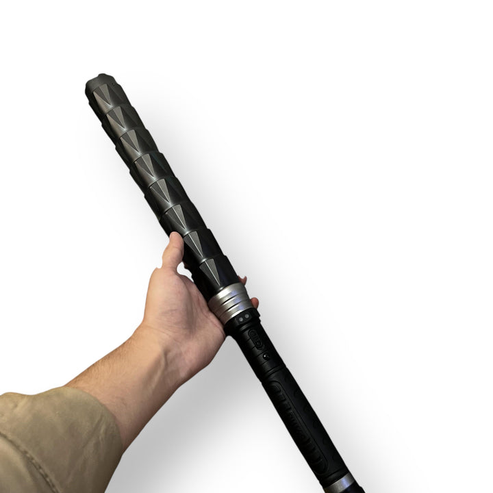 Black alloy electric baton with textured segmented shaft and silver accents for self-defense