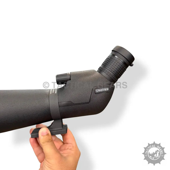 Black 75x80 spotting scope with angled eyepiece and adjustable focus knob for outdoor viewing