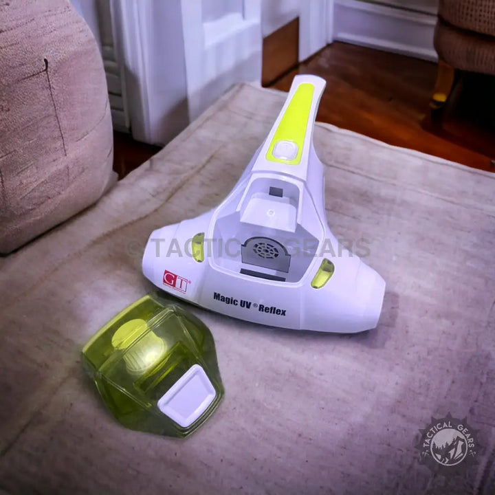 Disassembled Anti Mite Vacuum Cleaner with translucent green dustbin for mite removal