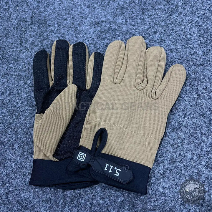 Pair of tan and black tactical anti-skid gloves for shooting, gym, and work use