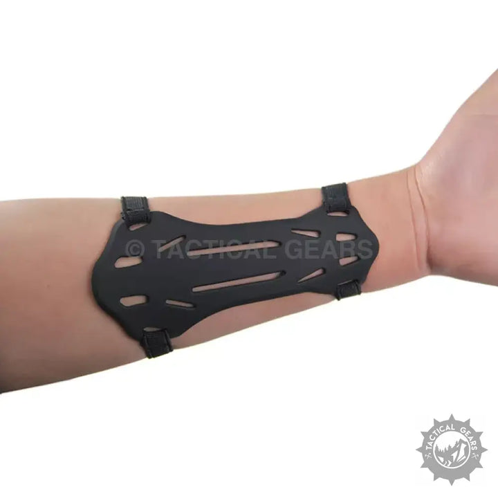 Black plastic archery arm guard with adjustable straps for comfortable arm protection