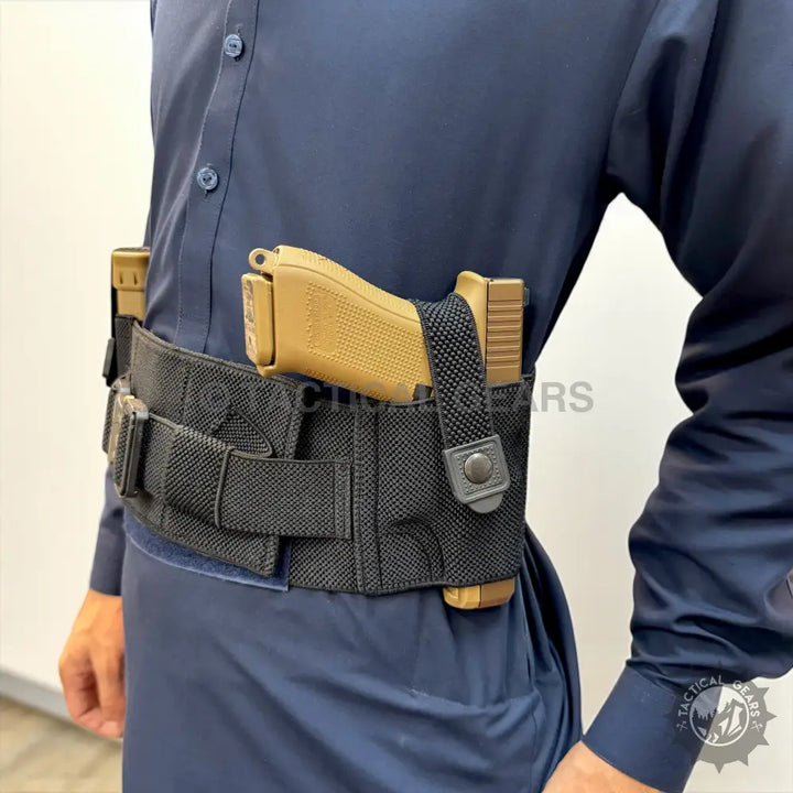 Tactical belly band holster with tan pistol in black holster and magazine pouches for concealed carry