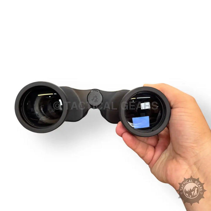 Black 10x50 binoculars with textured grip and exposed objective lenses for outdoor viewing