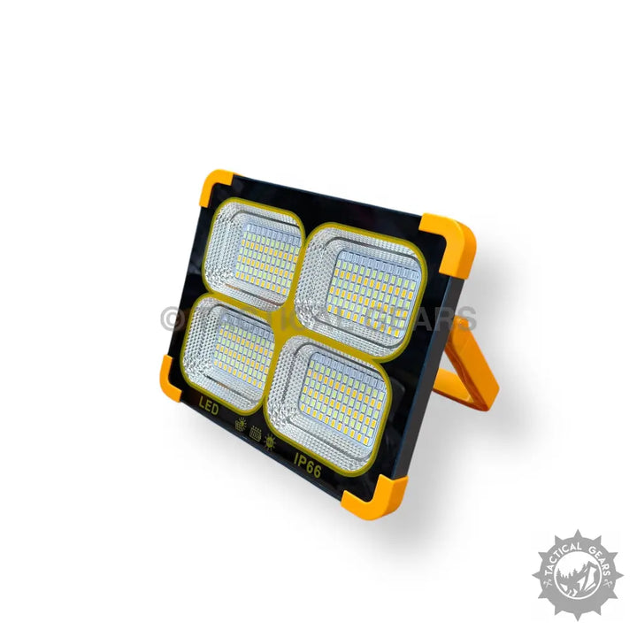 Portable Black and Yellow Solar Flood Light with four LED panels and protective corners