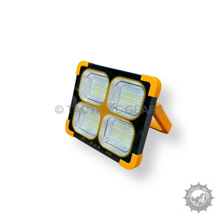 Black and Yellow Solar Flood Light with four LED panels and kickstand for outdoor illumination