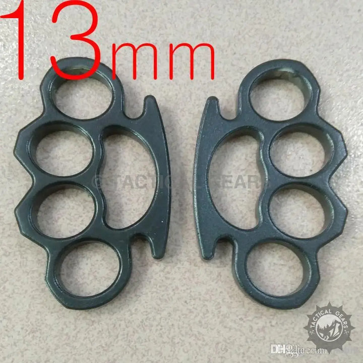 Heavy steel knuckles made of dark grey metal with four finger holes for durability