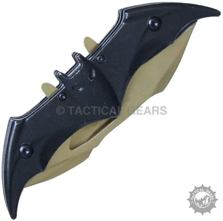 Black and tan bat-shaped folding knife with stainless steel blade and black metal finish