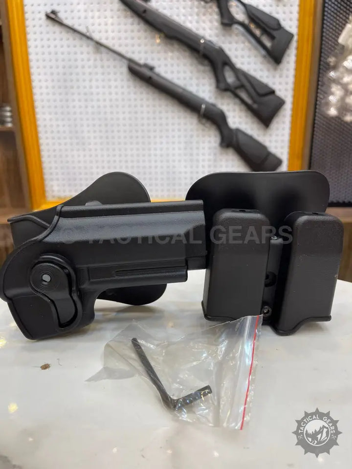 Black polymer holster with mag pouch for Beretta pistols and extra magazine storage