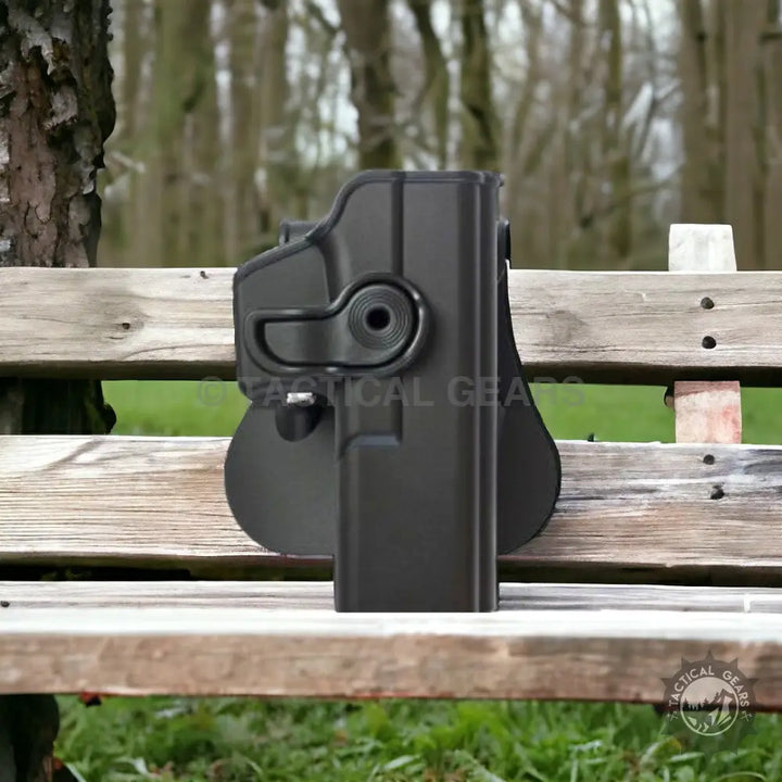 Black polymer pistol holster with quick-release button for Glock, durable polymer holster
