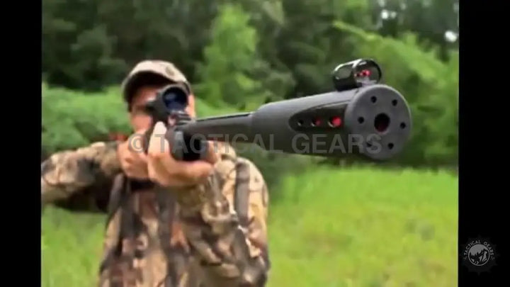 Hunter aiming a Gamo Whisper Fusion air rifle with scope for precision hunting